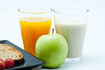 Breakfast with juice, fruit and milk
