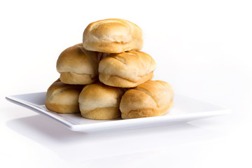 Butter bread on a plate on a white background