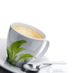 cup of coffee decorated stevia rebaudiana leaf