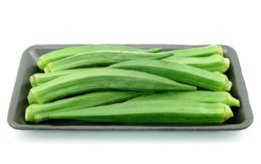 Okras in a  food trays isolated on white