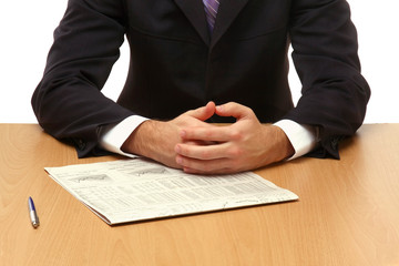 Unknown businessman sitting at table