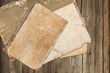 Old book and vintage papers on wood
