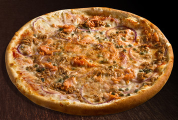 Pizza pesce with tuna fish, salmon, onion and capers - isolated