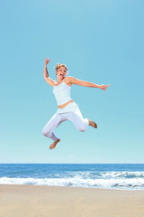 Fototapeta premium young beautiful woman jumping