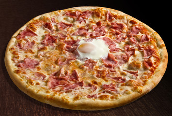 Pizza o sole mio with baked egg and ham - isolated