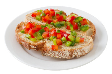 toasts with cut pepper on the plate