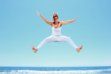 Fototapeta premium young beautiful woman jumping