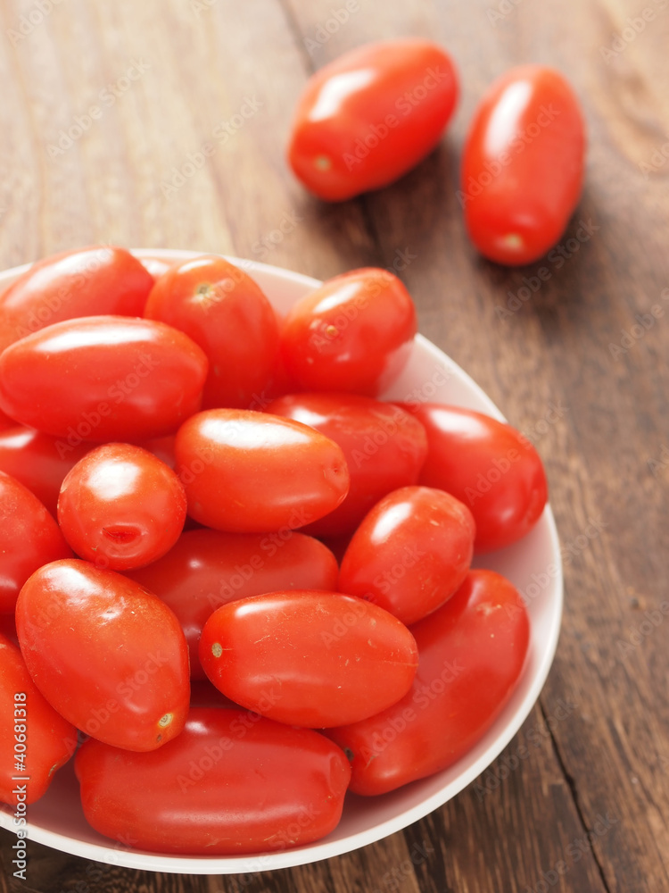 Sticker close up of a bowl of roma tomatoes