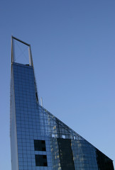 Building triangular high-rise from glass for offices