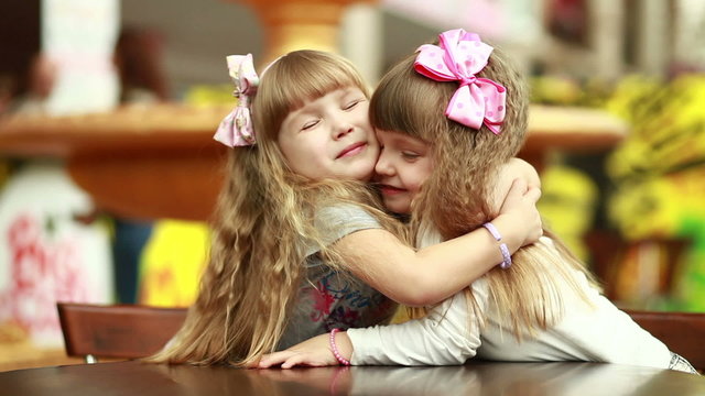 Little sisters hugging
