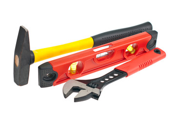 hammer, spirit level, a wrench