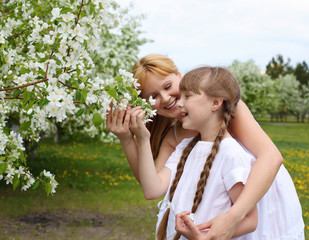 Fototapeta premium girl with mother in spring park