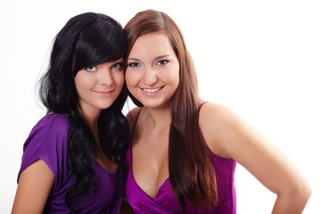 Two young women in violet dresses