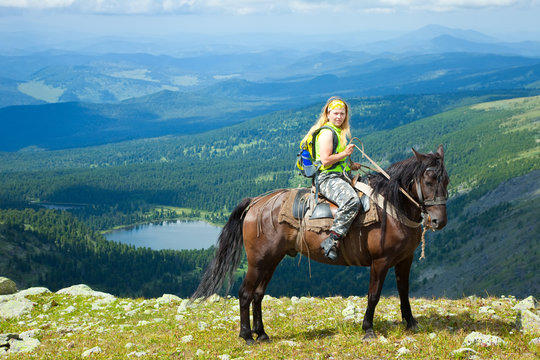 Female rider  at mountains