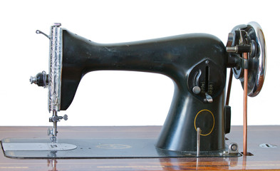 Antique sewing machine on white