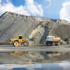 Excavator and truck in mine.