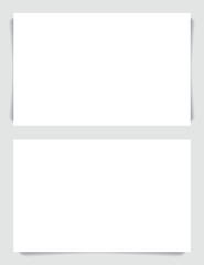 White memo notes or business cards with shadow.
