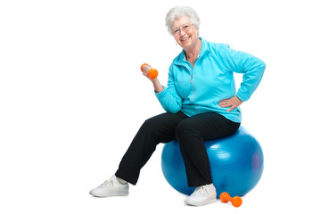 Senior woman working with weights in gym