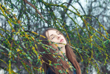 beautiful young woman enjoying the freshness of spring