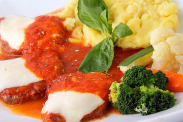 Veal with tomato and garnish close up