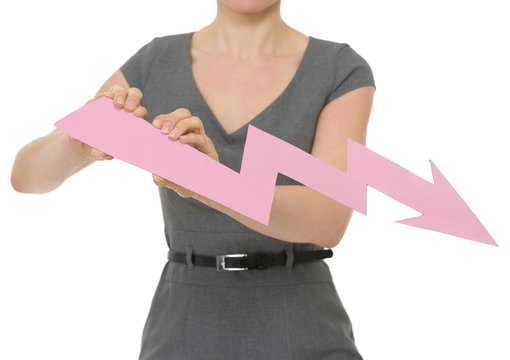 Closeup on decreasing chart arrow holding by female isolated