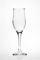 Empty transparent wine glass on white