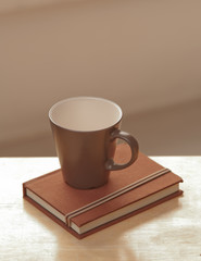 coffee cup with diary