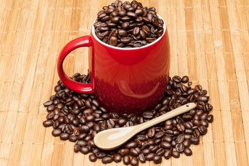 Red cup with whole coffee beans