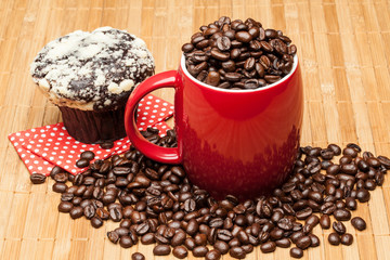 Red coffee cup with muffin