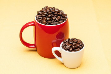Red and white cups with coffee beans