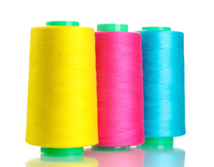 Bobbins of thread isolated on white