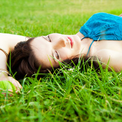 Pretty brunette woman wearing elegant dress relaxing outdoor