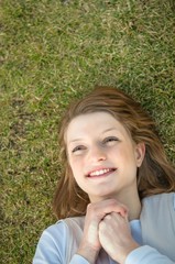 Young happy woman in grass
