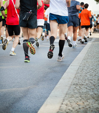 People Running In City Marathon On Street