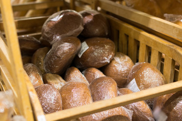 Round rye bread on shelf in supermarket