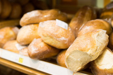 Round wheat bread on shelf in supermarket