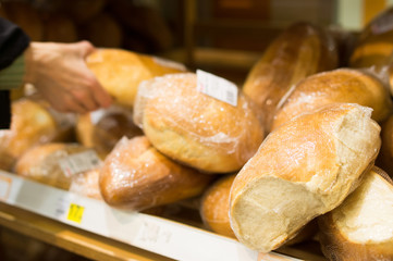Round wheat bread on shelf in supermarket