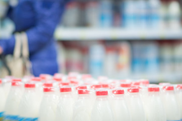 Milk bottles in supermarket
