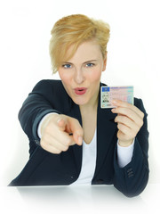 Young woman pointing to you  to get a driver licence