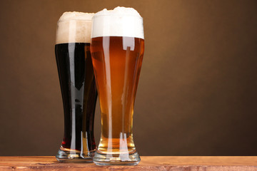 black and golden beer in glasses
