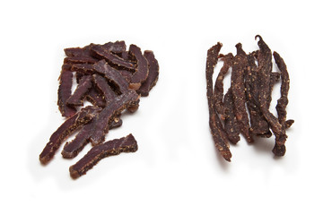 South African biltong strips  isolated on a white background