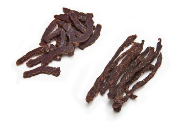 South African biltong strips  isolated on a white background