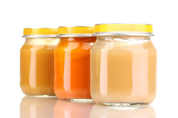 Jars of baby puree isolated on white