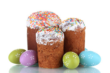 Beautiful Easter cakes and colorful eggs isolated on white