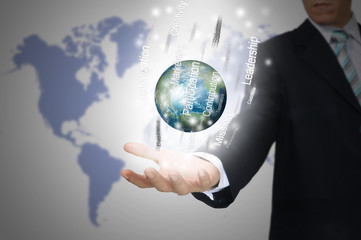 Hand of Business Man Hold Earth Globe surround by Business word.