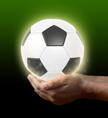soccer ball on hand