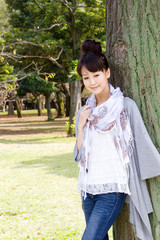 Fototapeta premium Beautiful young woman in the forest
