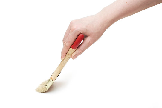 Hand And Paintbrush Isolated On White Background