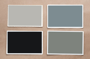 Set of four old, blank picture on gray cardboard background