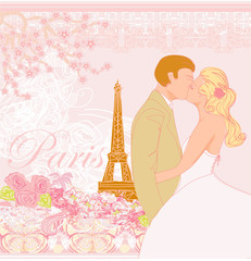 Fototapeta na wymiar wedding couple in Paris kissing near the Eiffel Tower
